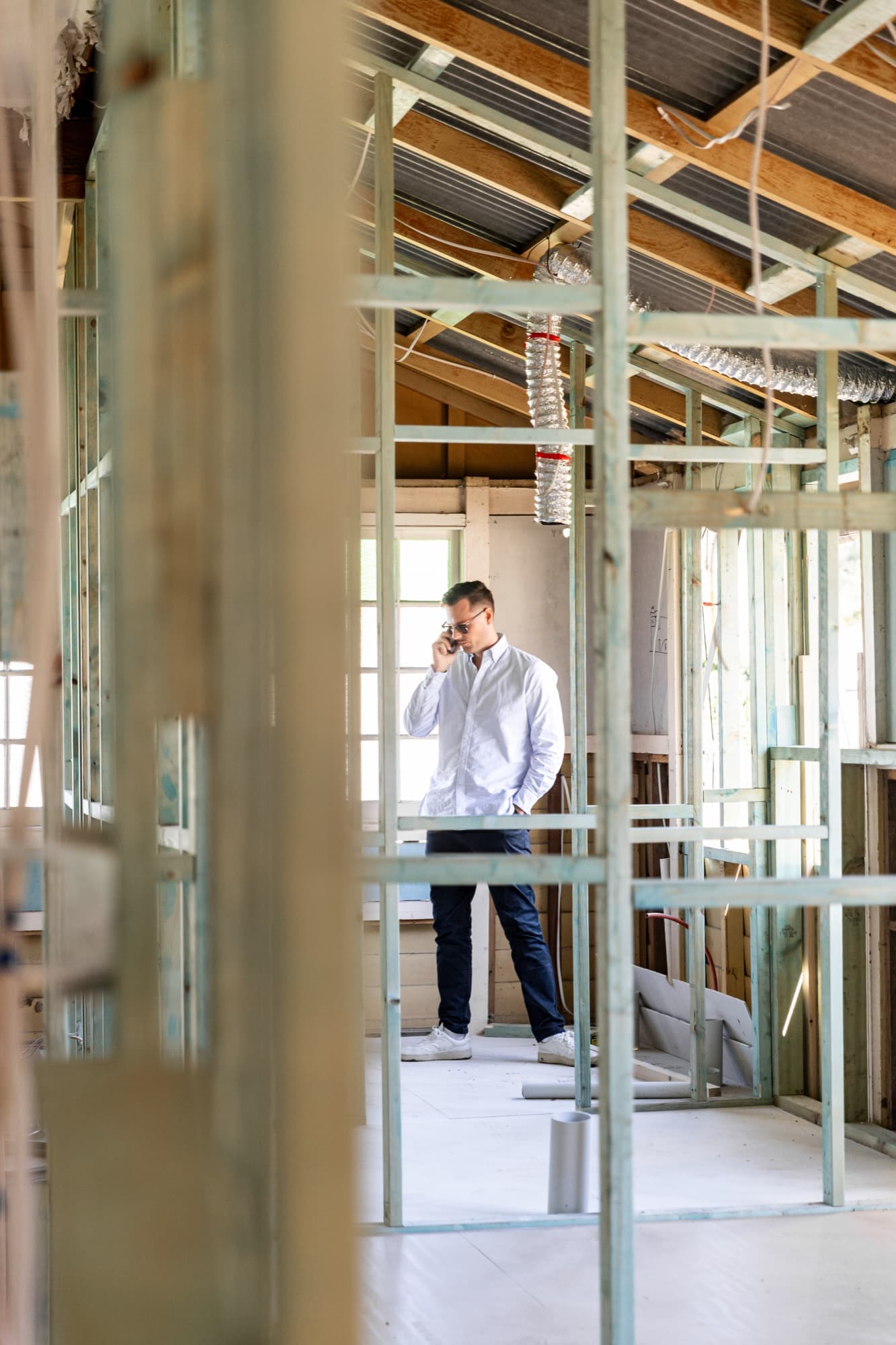 Jack Freestone of Buyers Collective on the phone during a building inspection in Brisbane